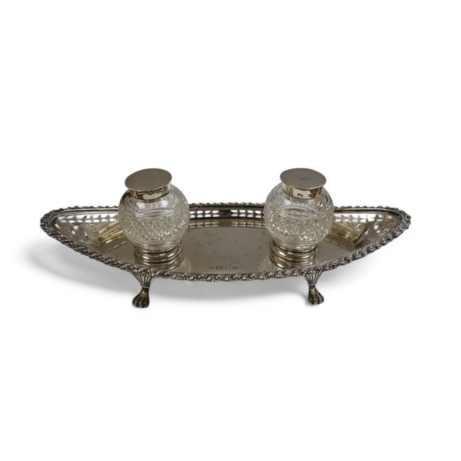 An Edwardian silver navette shaped inkstand, with two mounted glass wells, I.S. Greenburg & Co, Birmingham, 1901, 25.3cm, 7.5oz. Condition - fair